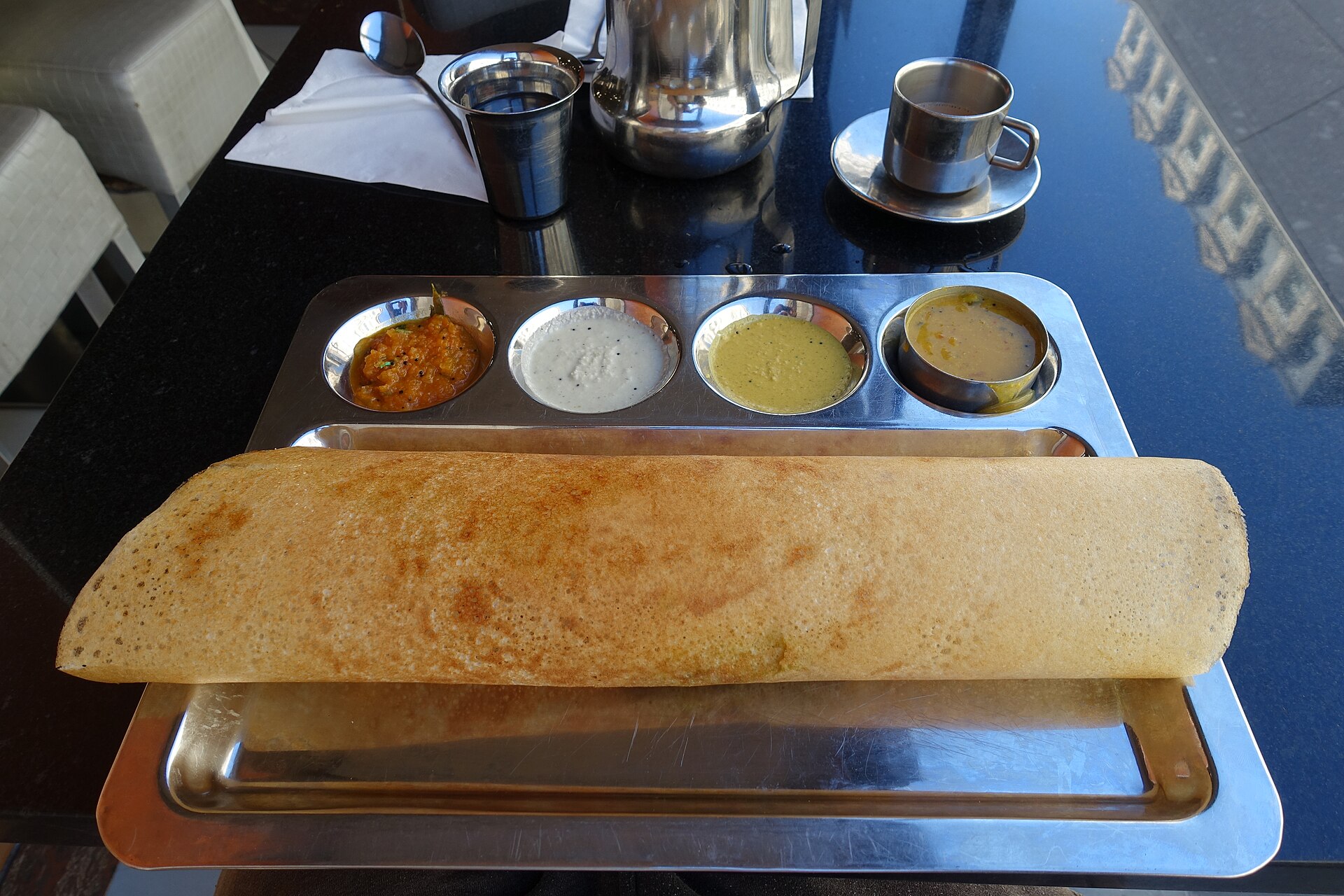 Masala dosa served with chutney.