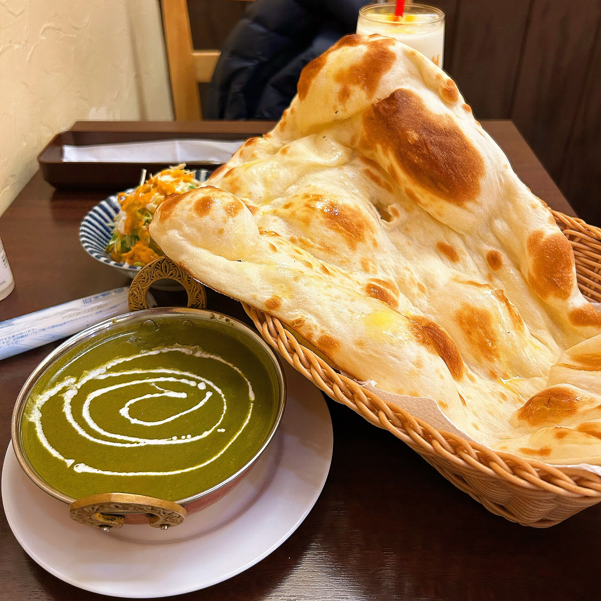 Palak paneer with cottage cheese in a spinach gravy.